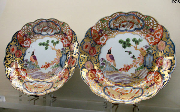 Meissen porcelain bowls (c1740) painted with brocade décor, bird looking in mirror & with Phoenixes inside hexafoils at Meissen porcelain museum at Lustheim Palace. Munich, Germany.