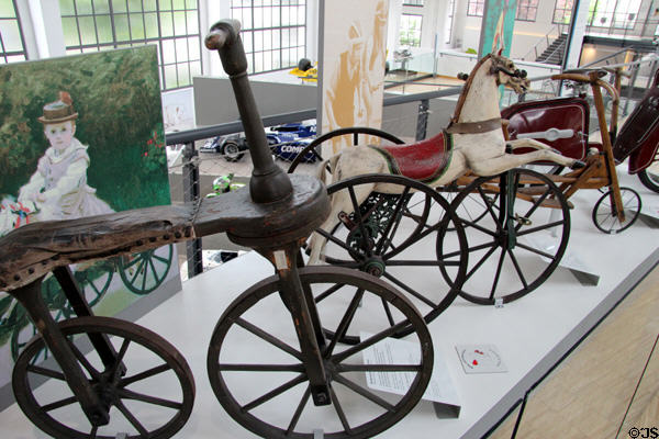 Child's velocipede (aka dandy horse or hobbyhorse) (early 20thC) & tricycle with horse as seat (c1880) from France at Deutsches Museum Transport Museum. Munich, Germany.