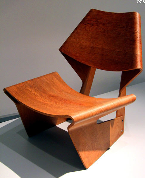 Molded layered wooden chair (1963) by Grete Jalk for Poul Jeppesen Stor of Denmark at Pinakothek der Moderne. Munich, Germany.