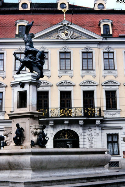 Facade of Stadtische Kunstsammilungen (Schaezler Palace - Municipal Art Gallery) with fountain of St George Slaying Dragon. Augsburg, Germany.