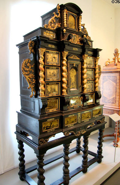 Cabinet made of blackened fruitwood & gilded brass with India ink drawings behind glass (c1670) from Augsburg at Maximilian Museum. Augsburg, Germany.