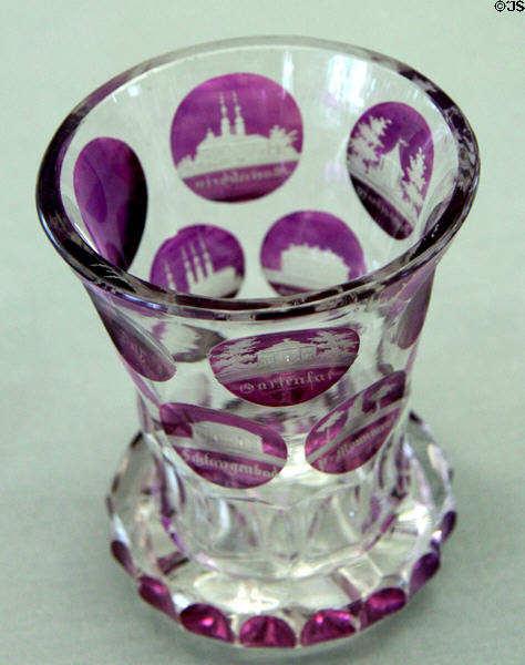 Two-colored goblet where outer violet color is cut away & etched to show local views around Teplitz (mid 19thC) from northern Bohemia at Coburg Castle. Coburg, Germany.