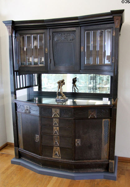 Carved oak & brass sideboard with mirror & glass display cases (c1900) by Hoffmeister & Grasser of Coburg, Germany at Coburg Castle. Coburg, Germany.