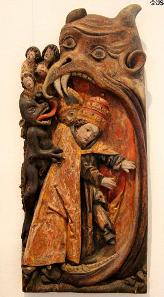 Gate of paradise where a Pope & Bishop assigned to flames on altar wood carving (1st quarter 16thC) from Franconia at Coburg Castle. Coburg, Germany.