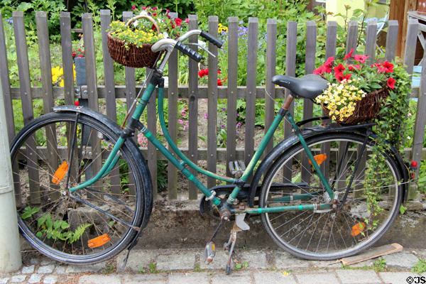 Bicycle with flowers at Gößweinstein pilgrimage basilica. Gößweinstein, Germany.