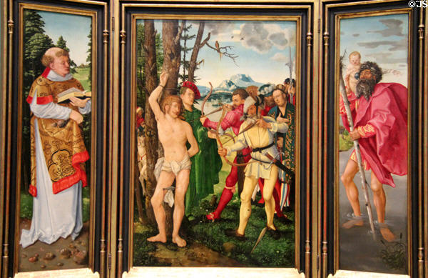 Martyrdom of St Sebastian with panel wings of St Stephen & St Christopher altar painting (1507) by Hans Baldung Grien at Germanisches Nationalmuseum. Nuremberg, Germany.