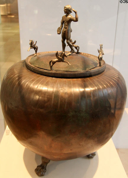 Greek bronze covered vessel (dinos) with discus throwing figure used to mix wine & water (early 5thC BCE) from Capus at Germanisches Nationalmuseum. Nuremberg, Germany.
