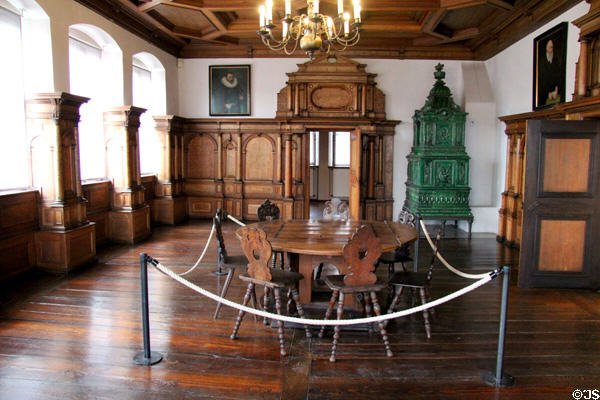 Green tile room stove & table & stools in Beautiful room saved from Pellerhaus (c1605) at Fembohaus City Museum. Nuremberg, Germany.