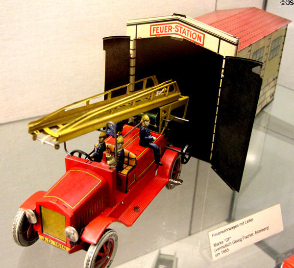 Toy ladder firetruck with fire station (c1955) at City Toy Museum. Nuremberg, Germany.