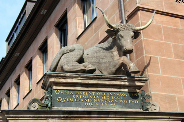 Ox statue atop portal marks former meat market beside Pegnitz River. Nuremberg, Germany.