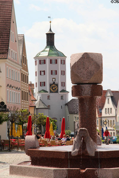 Modern fountain & Kueturm (cow tower) viewed from market square. Günzburg, Germany.