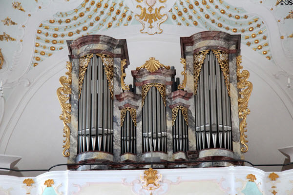 Gilded decorative work surrounding organ pipes at Liebfrauenkirche. Günzburg, Germany.