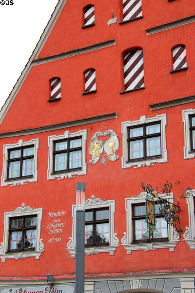 Detail of red heritage building (1647) on Schrannenplatz. Memmingen, Germany.