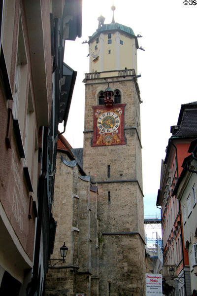 Gothic bell tower (14thC) of St Martin Lutheran church with more modern clock fixed to exterior. Memmingen, Germany.