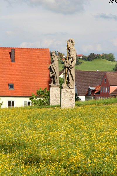 Religious figures set in meadow in Ottobeuren. Ottobeuren, Germany.