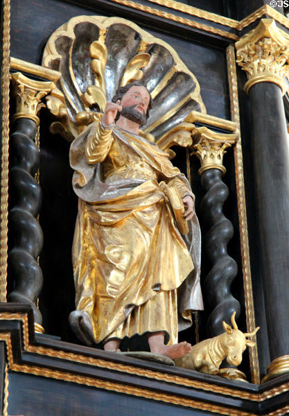 Statue of Evangelist St Luke with his bull symbol in St Benedict church at Benediktbeuern Abbey. Germany.
