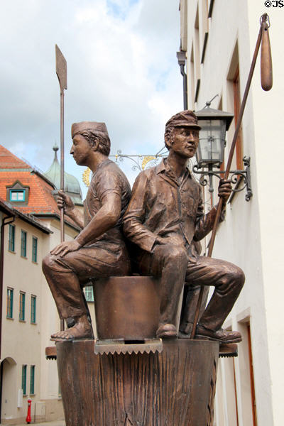 Brotbrunnen (bread fountain) dedicated to bread making on Schrannengasse in town center. Füssen, Germany.