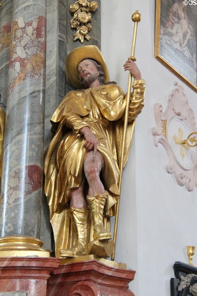 St. Roch pointing to his symbol, a boil (wound on his thigh as result of plague), in Church of Sts Peter & Paul. Mittenwald, Germany.