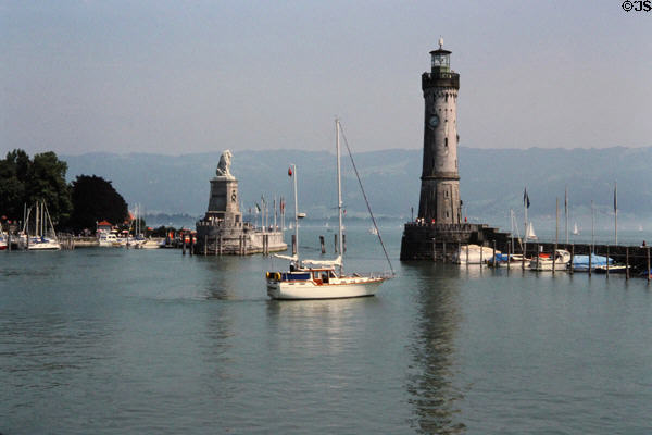 Entrance to Lindau port commanded by lighthouse (1856) & monument to Lion of Bavaria (1856). Lindau im Bodensee, Germany.