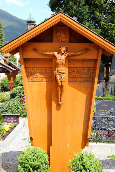 Carved grave marker (1949) at St Peter & Paul church. Oberammergau, Germany.