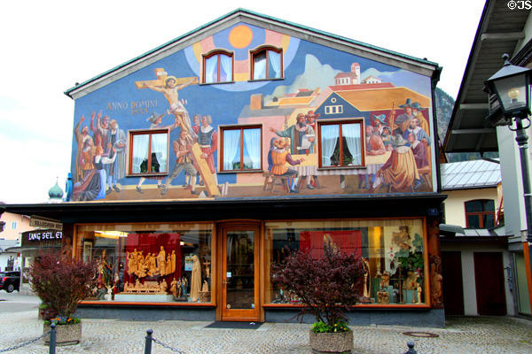 Shop window with wood carving & upper story covered with frescoes. Oberammergau, Germany.