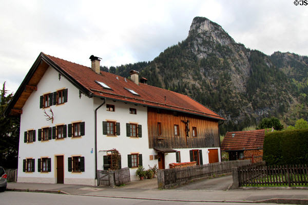 Traditional style building adorned with deer antlers & crucifix. Oberammergau, Germany.