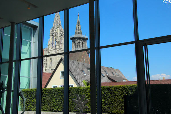 View of Ulm Cathedral spires through windows of Kunsthalle Weishaupt. Ulm, Germany.