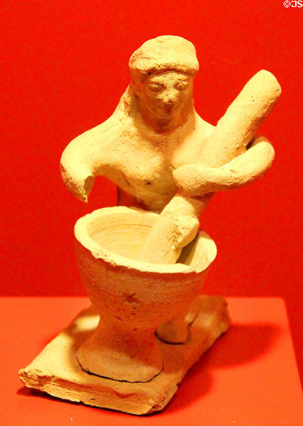 Greek terracotta sculpture of woman pounding grain (5thC BCE) at Museum of Bread and Art. Ulm, Germany.
