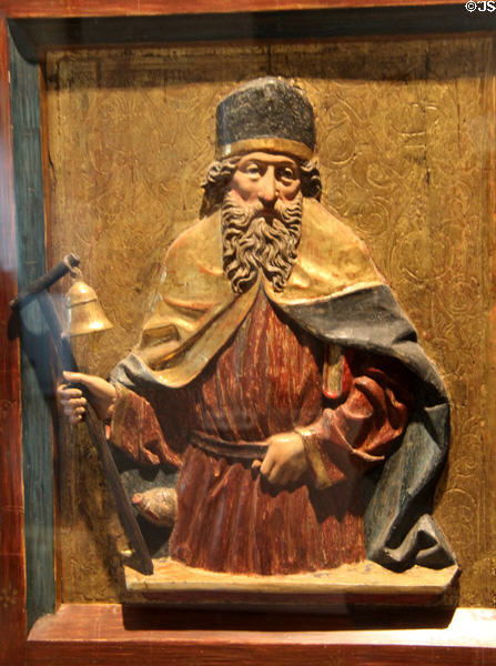 St. Anthony the Hermit (aka Anthony Abbot) with his attributes staff, bell & pig, wood carving (c1500) by Michael Pacher school in Austria at Museum of Bread and Art. Ulm, Germany.
