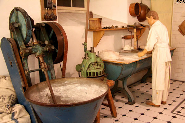 Model bakery working area (c1910) including working table, dough dividing machine & dough kneading machine at Museum of Bread and Art. Ulm, Germany.