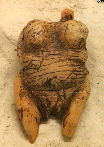 Headless ivory female figure (35-40,000 yrs. old) from caves of Swabian Alb at Ulmer Museum. Ulm, Germany.