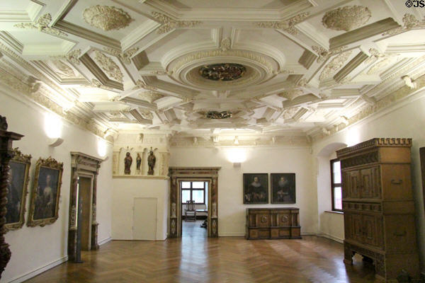 Gallery with coffered ceiling (16thC) showing painting & antique furniture at Ulmer Museum. Ulm, Germany.