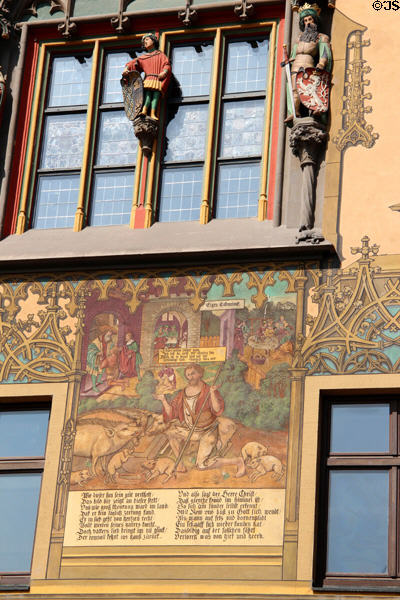 Carved figures on window of Ulm Rathaus. Ulm, Germany.
