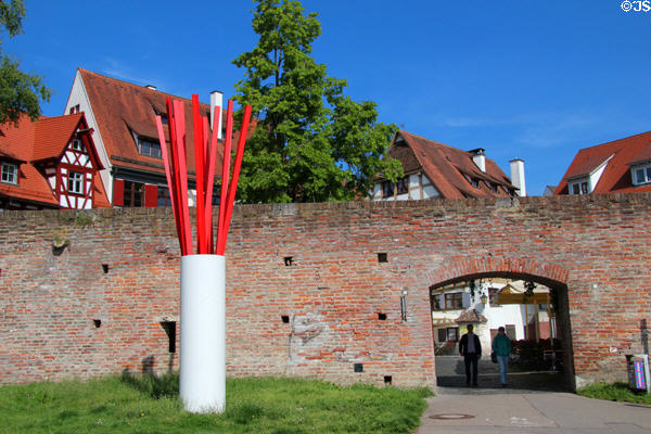 Ulm brick city wall (mid 1800's) with modern sculpture beside gate leading from Danube to Fischergasse. Ulm, Germany.