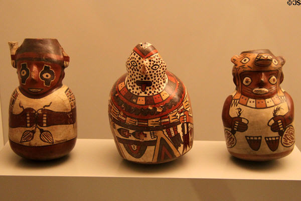 Three Nazca culture ceramic bottles showing carriers of goods (100-700) from Peru at Museum of America. Madrid, Spain.