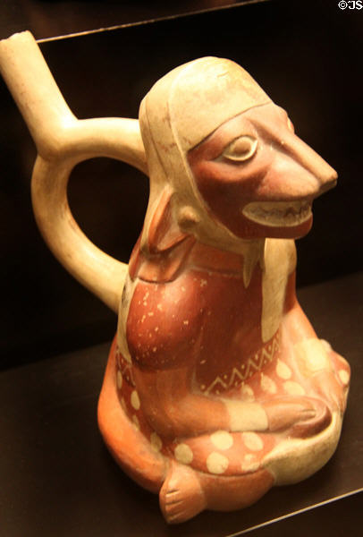 Moche ceramic stirrup-spout bottle figure with animal face (100-700) from Peru at Museum of America. Madrid, Spain.