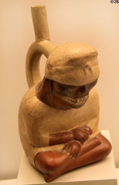 Moche ceramic stirrup-spout bottle of a sick man (100-700) from Peru at Museum of America. Madrid, Spain.
