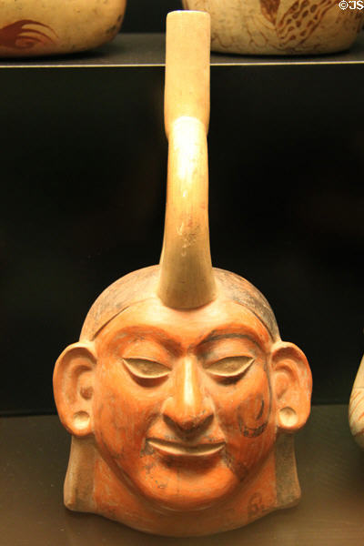 Moche ceramic stirrup-spout portrait bottle (100-700) from Peru at Museum of America. Madrid, Spain.
