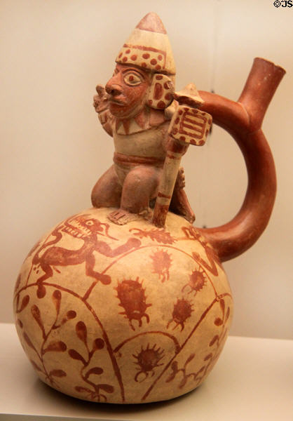 Moche ceramic stirrup-spout bottle with figure of warrior (100-700) from Peru at Museum of America. Madrid, Spain.