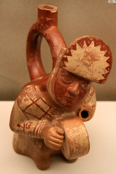 Moche ceramic stirrup-spout bottle with figure of drummer (100-750) from Peru at Museum of America. Madrid, Spain.