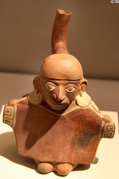Moche ceramic stirrup-spout bottle man with serape & earrings (100-700) from Peru at Museum of America. Madrid, Spain.