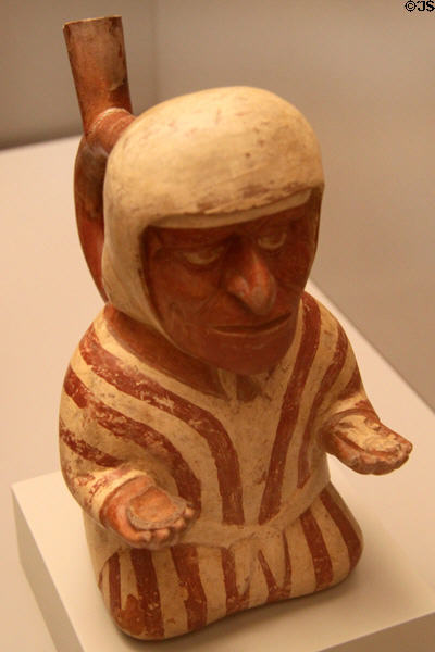 Moche ceramic stirrup-spout bottle man in stripped robe (100-700) from Peru at Museum of America. Madrid, Spain.