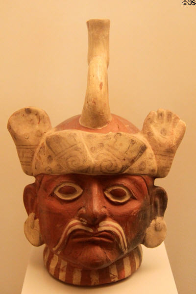 Moche ceramic stirrup-spout bottle portrait head of distinguished hat & mustache (100-700) from Peru at Museum of America. Madrid, Spain.