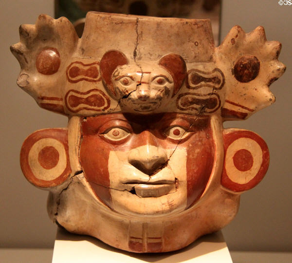 Moche ceramic vessel head with face painting & jaguar headdress (100-700) from Peru at Museum of America. Madrid, Spain.