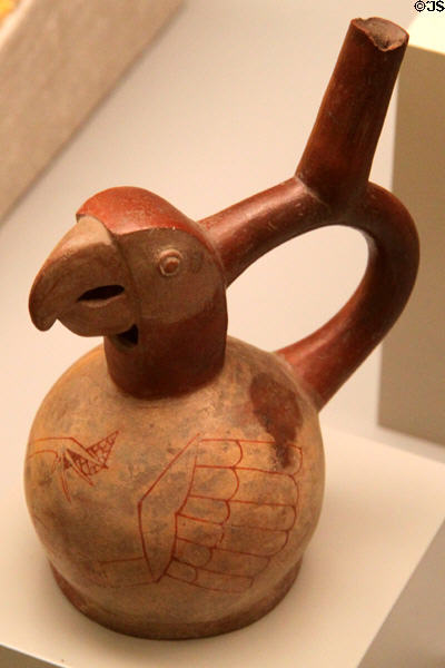 Moche ceramic stirrup-spout bottle in shape of parrot (100-700) from Peru at Museum of America. Madrid, Spain.