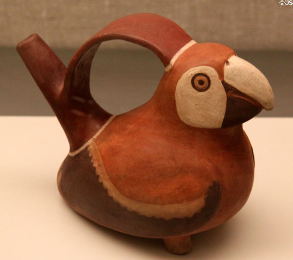 Moche ceramic stirrup-spout bottle in shape of parrot (100-700) from Peru at Museum of America. Madrid, Spain.
