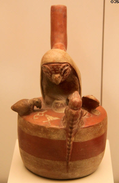 Moche ceramic stirrup-spout bottle in shape of bird surrounded by young (100-700) from Peru at Museum of America. Madrid, Spain.