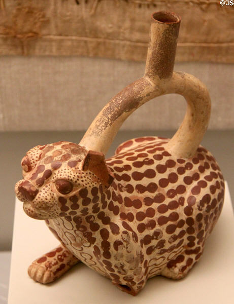 Moche ceramic stirrup-spout bottle in shape of jaguar (100-700) from Peru at Museum of America. Madrid, Spain.