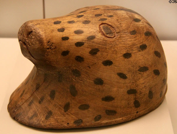 Inuit culture carved wooden helmet is shape of seal head used a lure (18thC) from Arctic America at Museum of America. Madrid, Spain.