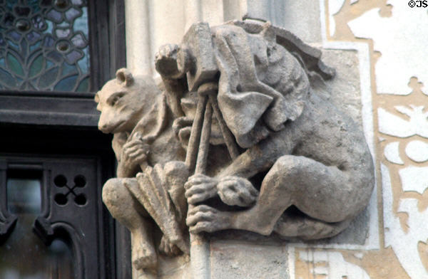 Carved dogs with camera on tripod on Casa Amatller. Barcelona, Spain.